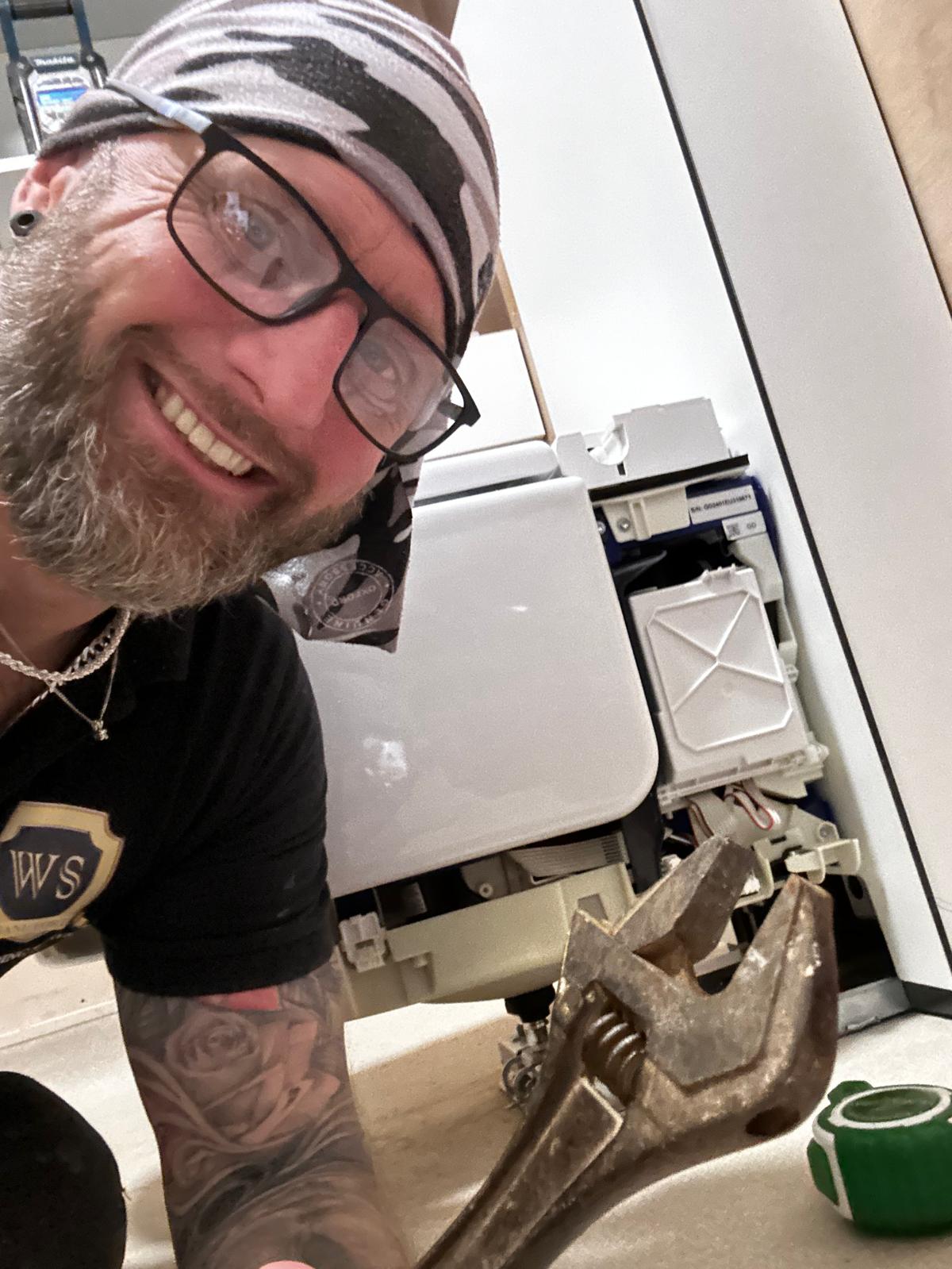 Picture of Craig Ward, Managing Director of WSBS crouched on the floor